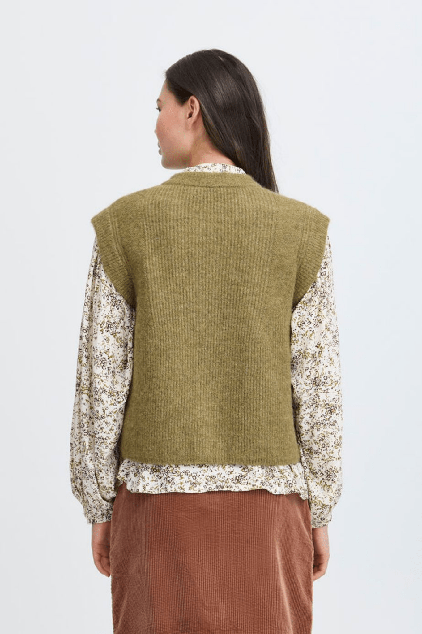 Atelier Rêve Irsilvi Waistcoat, crafted in a cosy moss melange green knit. Available at Dotique Witney