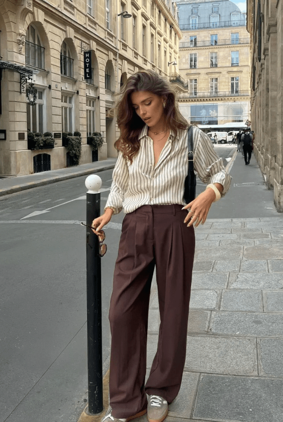 A woman in Autumn wearing brown trousers