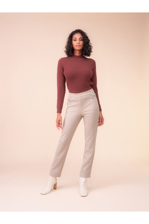 Model wearing Alison Sheri A48018 Tailored Beige Trousers styled with a fitted long sleeve top and white ankle boots by Alison Sheri. Shop Alison Sheri at Dotique.
