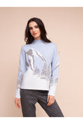Model wearing the Alison Sheri A48302 Knit Top by Alison Sheri featuring a winter mountain landscape design, shop Alison Sheri at Dotique.