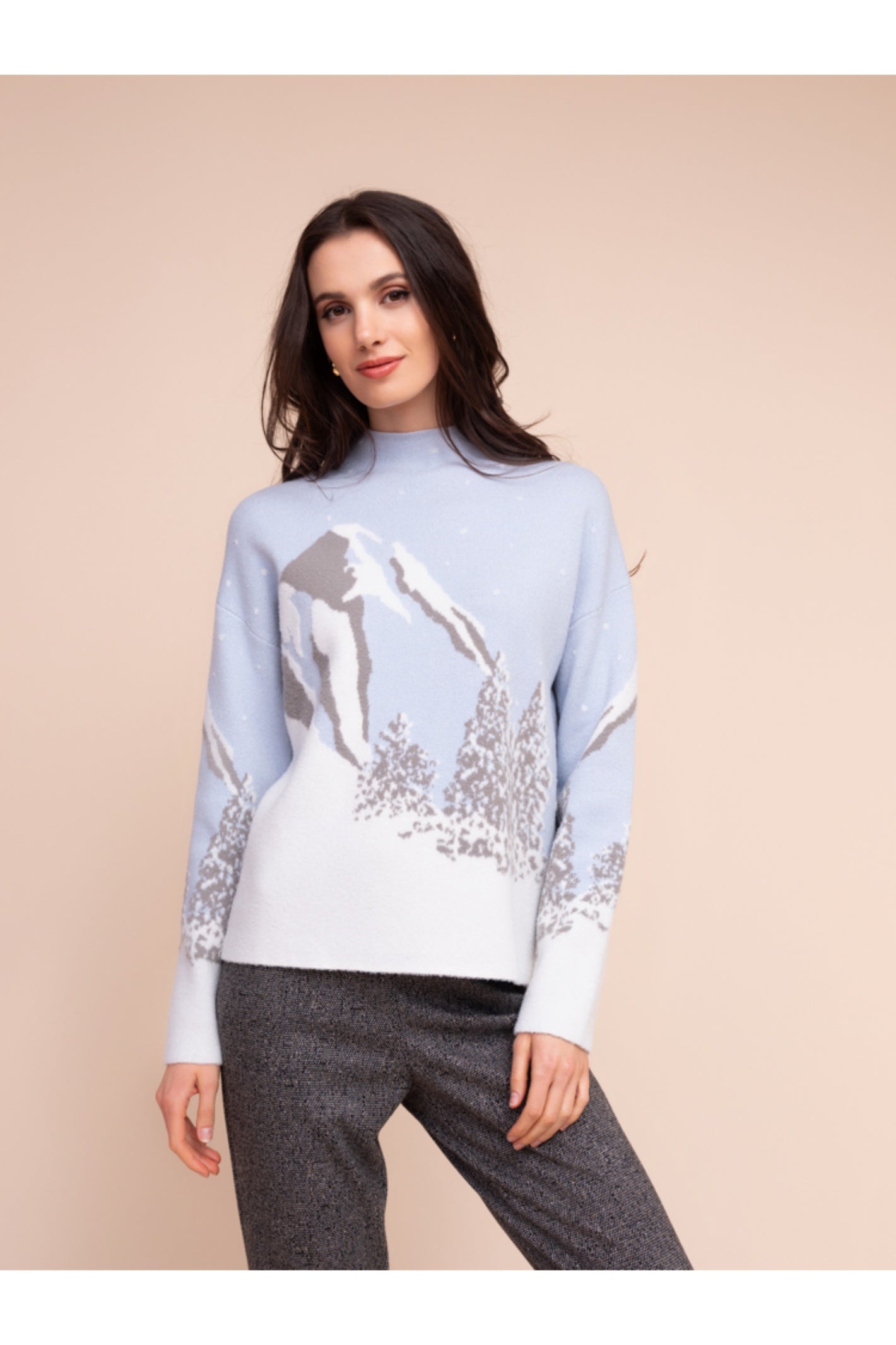 Model wearing the Alison Sheri A48302 Knit Top by Alison Sheri featuring a winter mountain landscape design, shop Alison Sheri at Dotique.