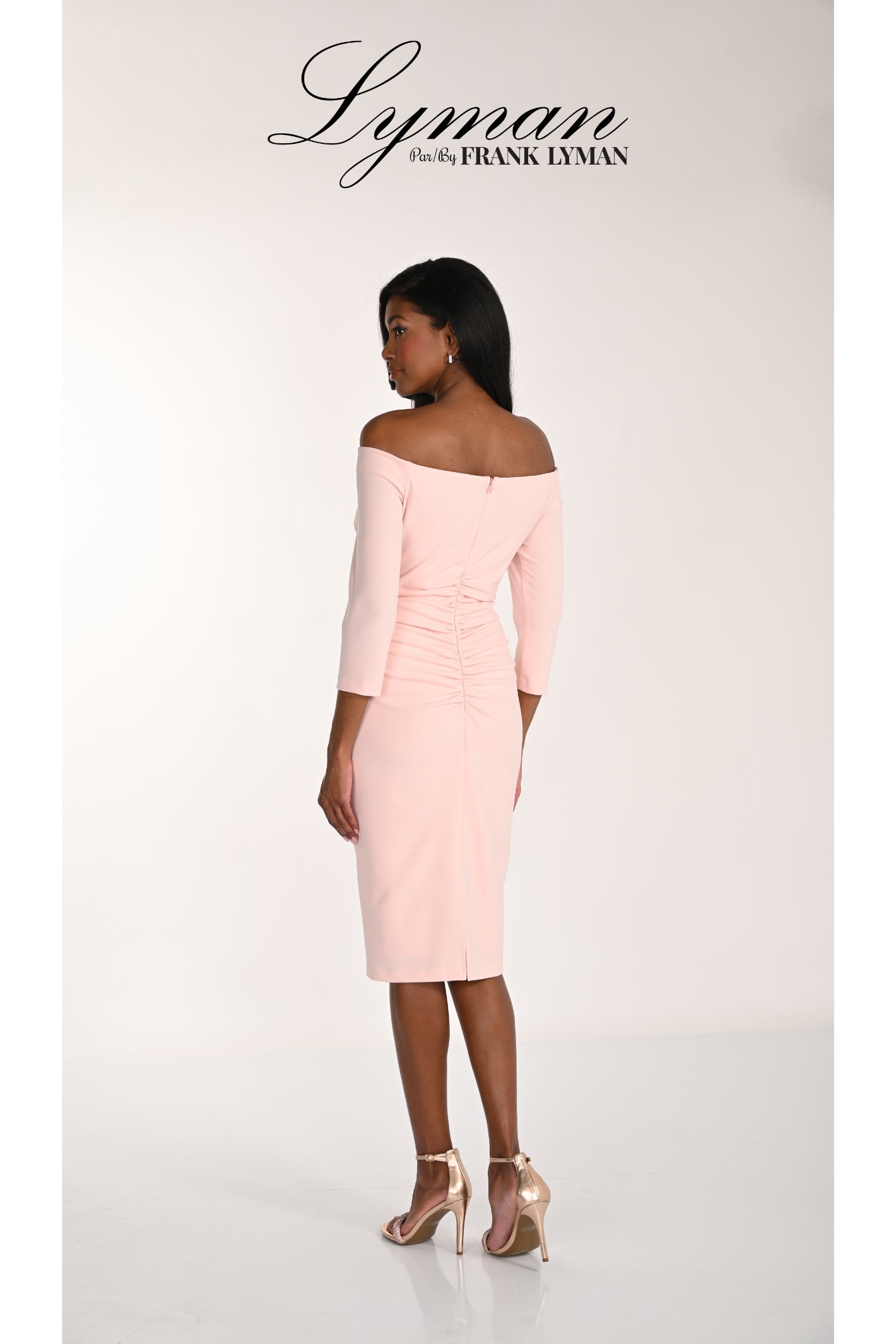 Woman wearing Frank Lyman 268116 Blush Off-Shoulder Occasion Dress by Frank Lyman Shop Frank Lyman at Dotique