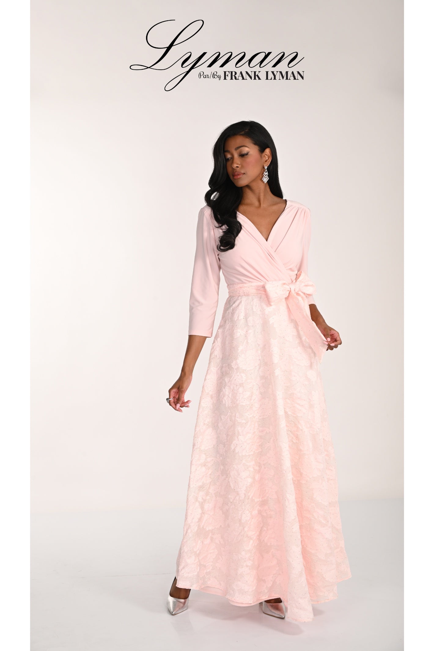 Model wearing Frank Lyman 268157 Blush Occasion Maxi Dress by Frank Lyman, shop the brand at Dotique online store.