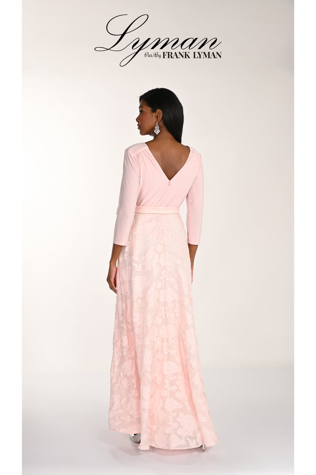 Model wearing Frank Lyman 268157 Blush Occasion Maxi Dress by Frank Lyman, shop Frank Lyman at Dotique