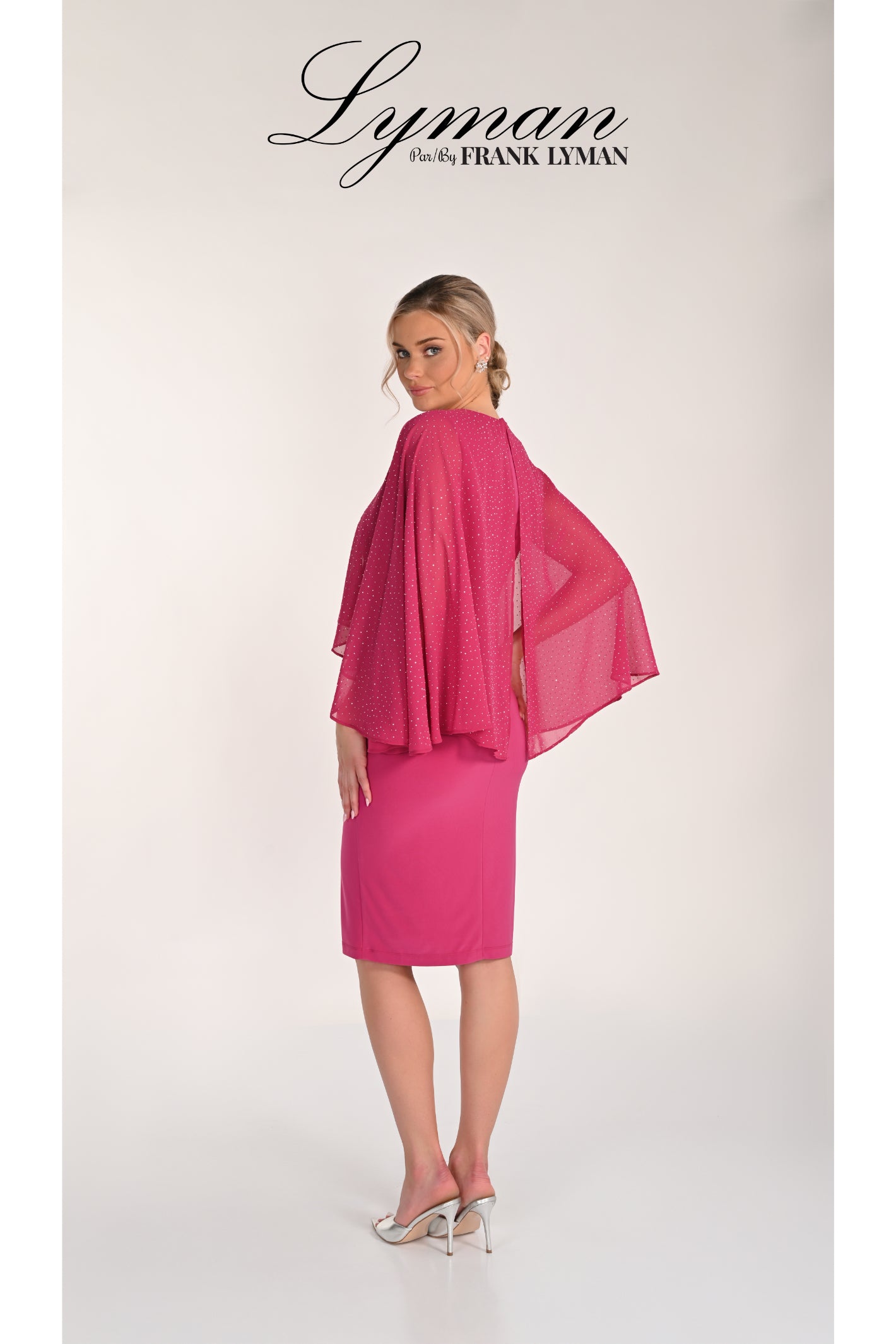Woman modeling Frank Lyman 268195 Magenta Embellished Cape Dress by Frank Lyman Shop Frank Lyman at Dotique