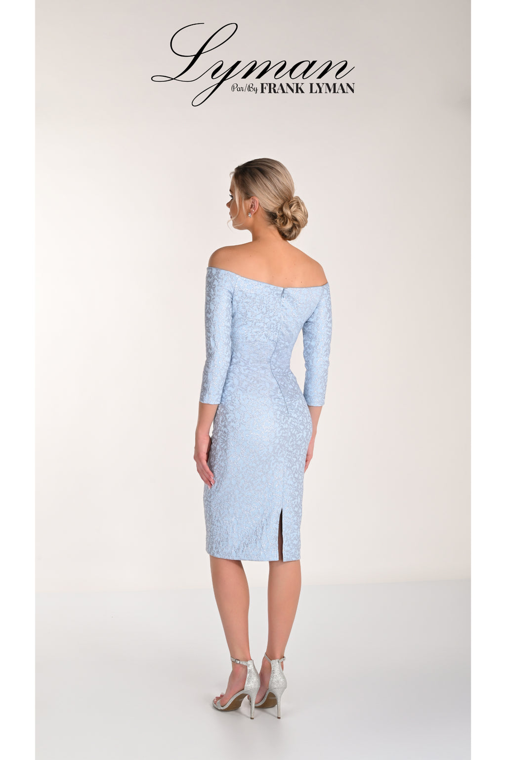 Elegant woman wearing Frank Lyman 268234 Light Blue Jacquard Off-Shoulder Dress by Frank Lyman Shop at Dotique