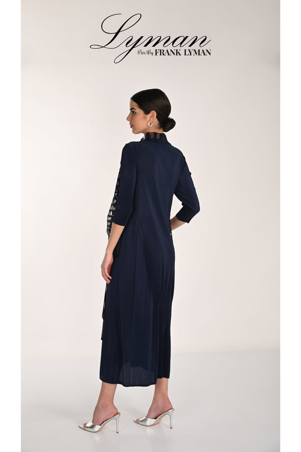 Elegant back view of woman wearing Frank Lyman 268506 Midnight Dress and Jacket by Frank Lyman shop at Dotique