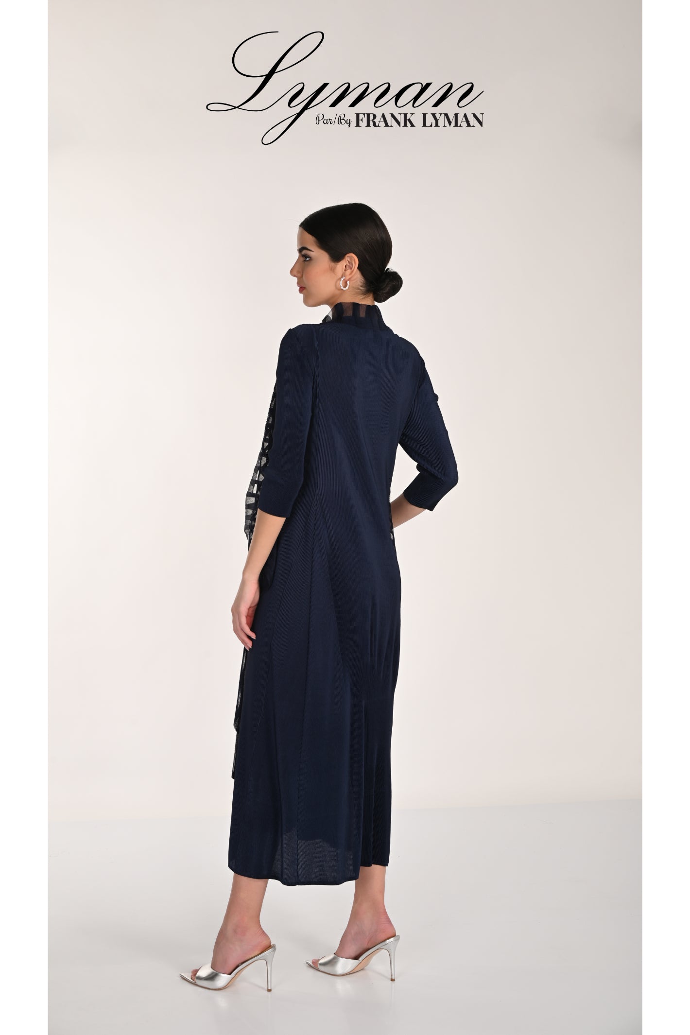 Elegant back view of woman wearing Frank Lyman 268506 Midnight Dress and Jacket by Frank Lyman shop at Dotique