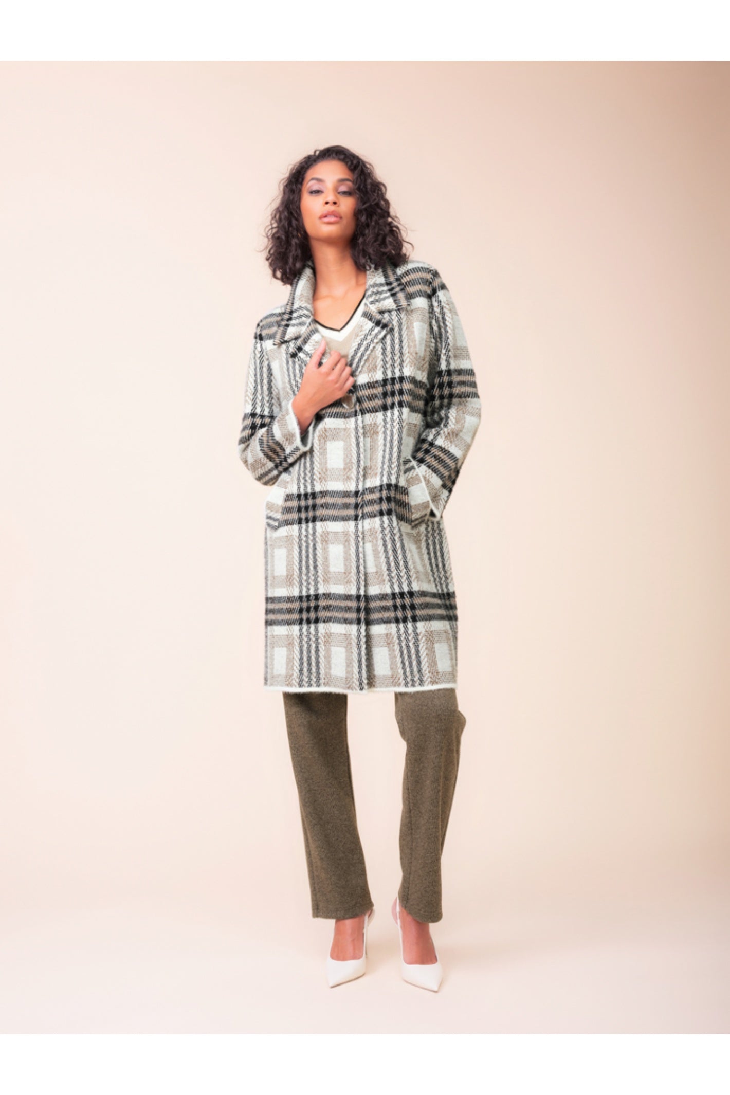 Model wearing the Alison Sheri A48125 Coat Dress in a neutral plaid pattern with a wide collar, shop Alison Sheri at Dotique.