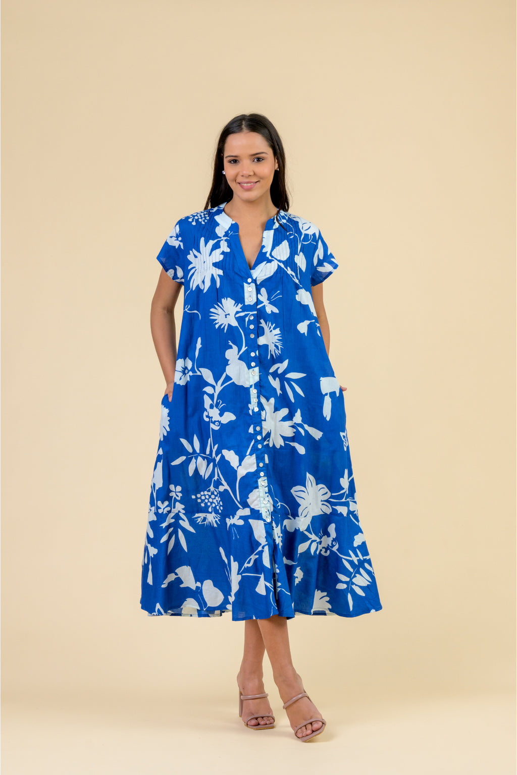 Handprint Dream Apparel AN1171A Leslie Dress Floral Blue in vibrant blue with white floral print, button front, and short sleeves by Handprint Dream Apparel. Shop Handprint Dream Apparel at Dotique.