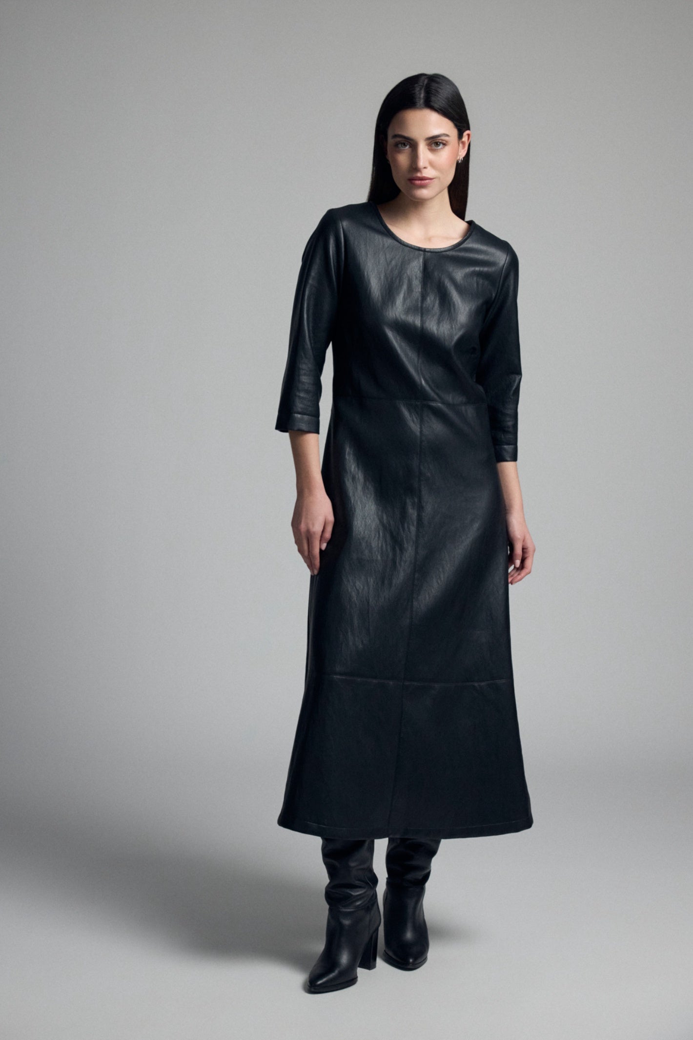 Shop the Tinta 4036502 Acanta Women's Dress in Black at Dotique. A timeless faux leather midi dress with a flattering silhouette, round neckline and three-quarter sleeves for effortless day-to-evening style.