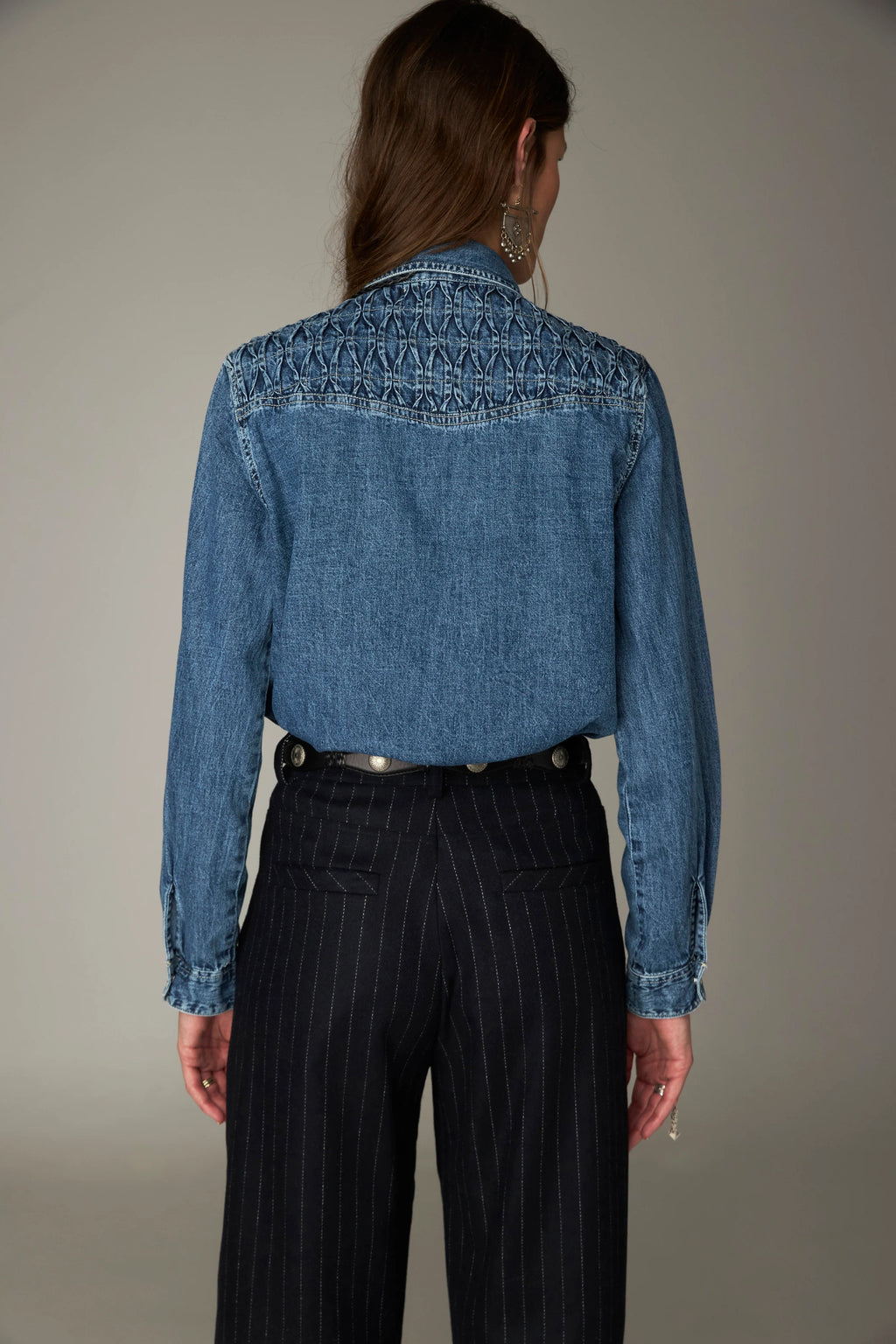 Shop the Maison Hotel Kumud Shirt in Blue Denim at Dotique. A 100% cotton denim shirt with Western-style detailing and popper buttons.