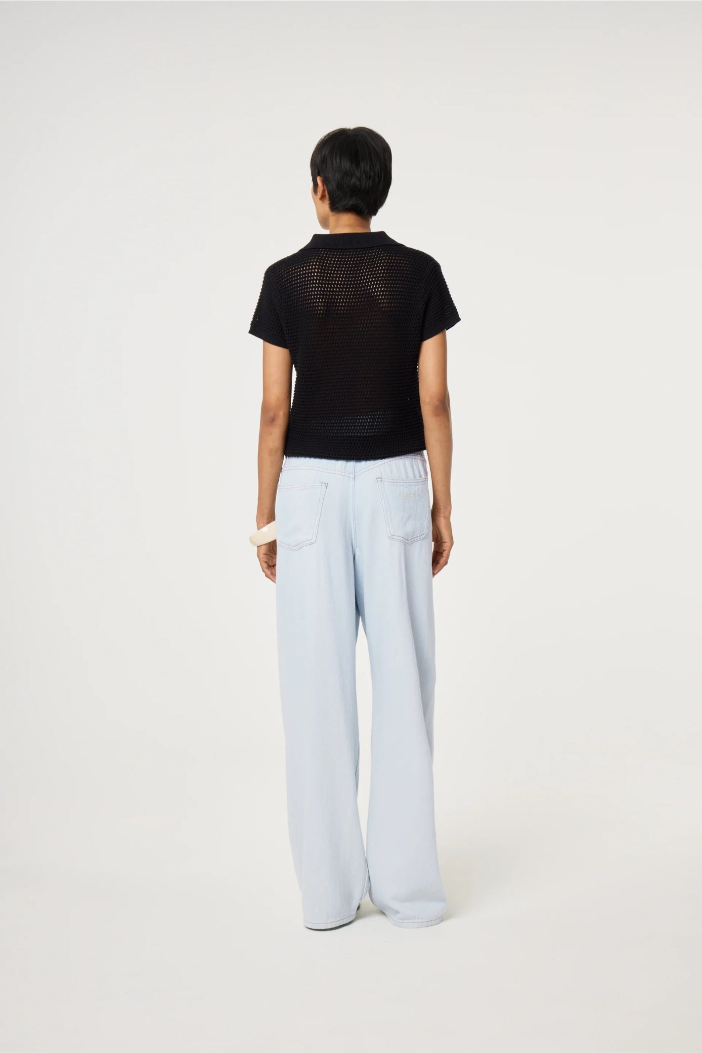 Back view of model wearing Fabienne Chapot Fin Jumper Black by Fabienne Chapot, shop Fabienne Chapot at Dotique