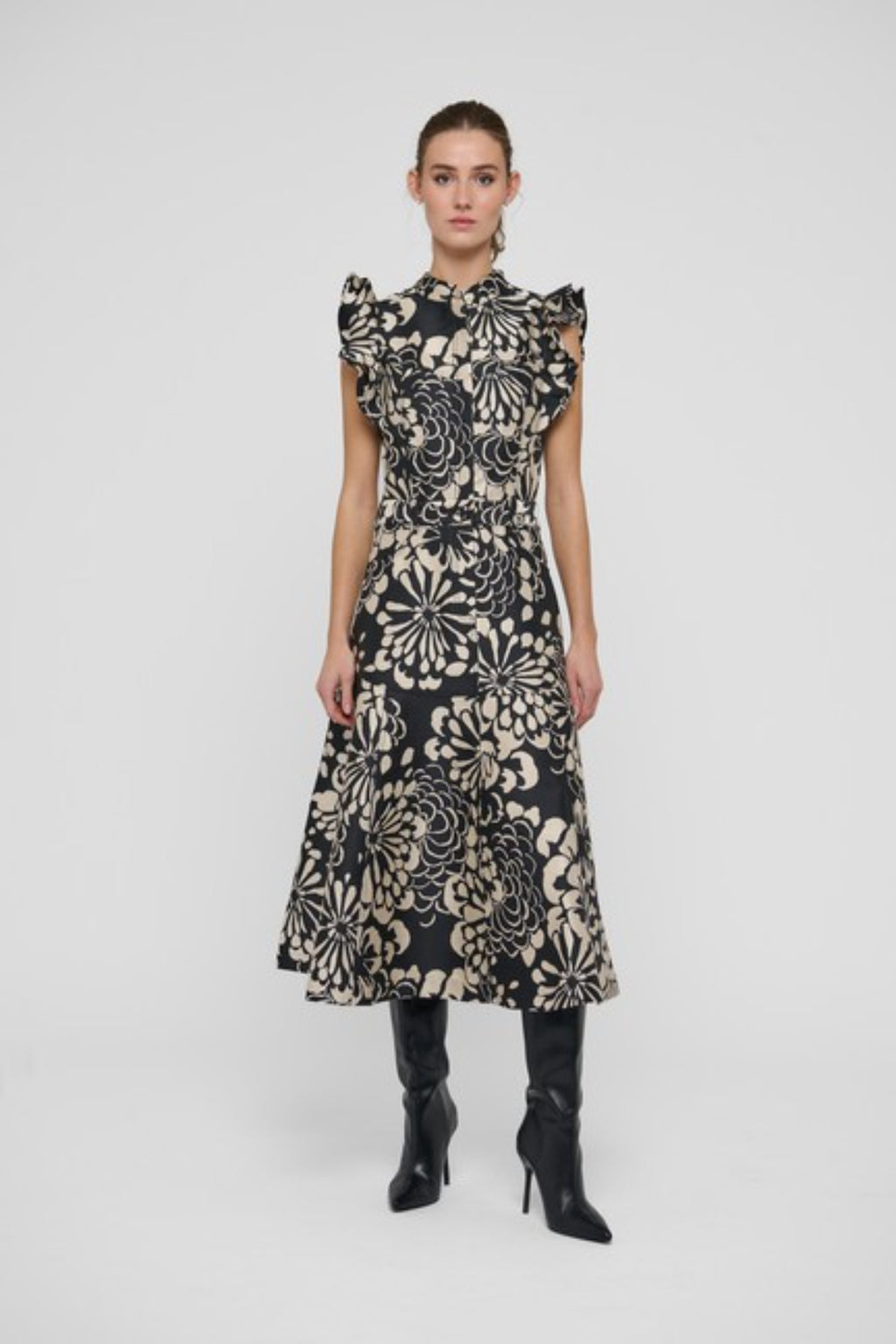 Shop the Dea Kudibal DevantiDEA Dress in Florana at Dotique. A floral jacquard midi dress with frill shoulders, denim details and a flattering flared skirt.