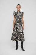 Shop the Dea Kudibal DevantiDEA Dress in Florana at Dotique. A floral jacquard midi dress with frill shoulders, denim details and a flattering flared skirt.