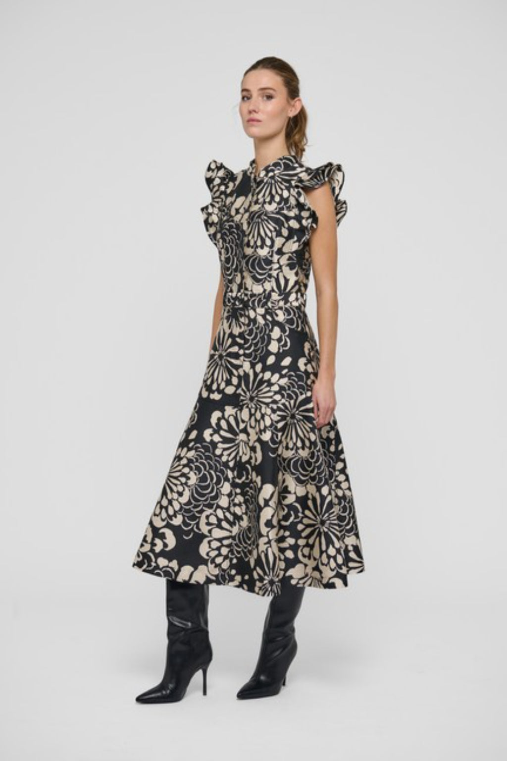 Shop the Dea Kudibal DevantiDEA Dress in Florana at Dotique. A floral jacquard midi dress with frill shoulders, denim details and a flattering flared skirt.