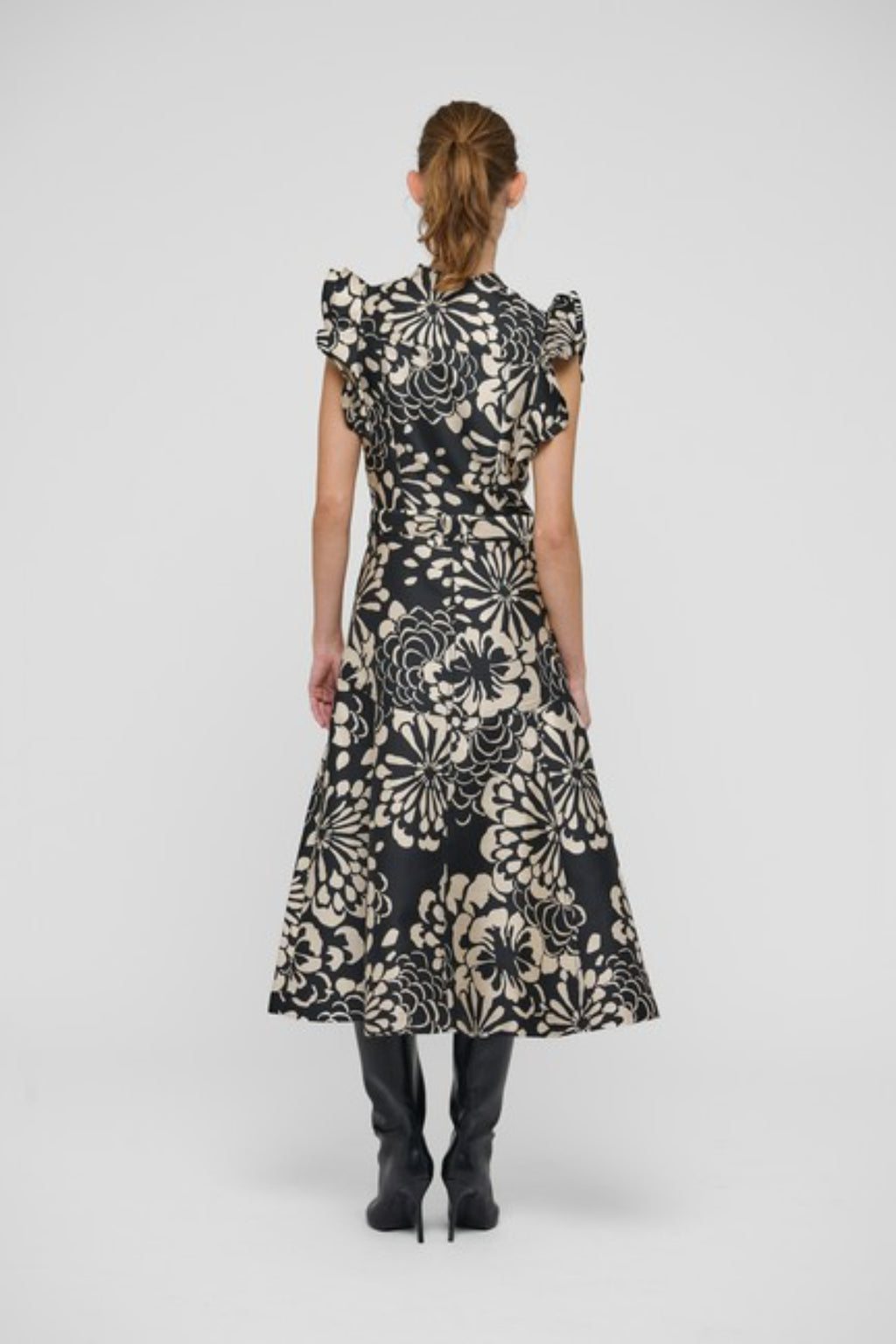 Shop the Dea Kudibal DevantiDEA Dress in Florana at Dotique. A floral jacquard midi dress with frill shoulders, denim details and a flattering flared skirt.