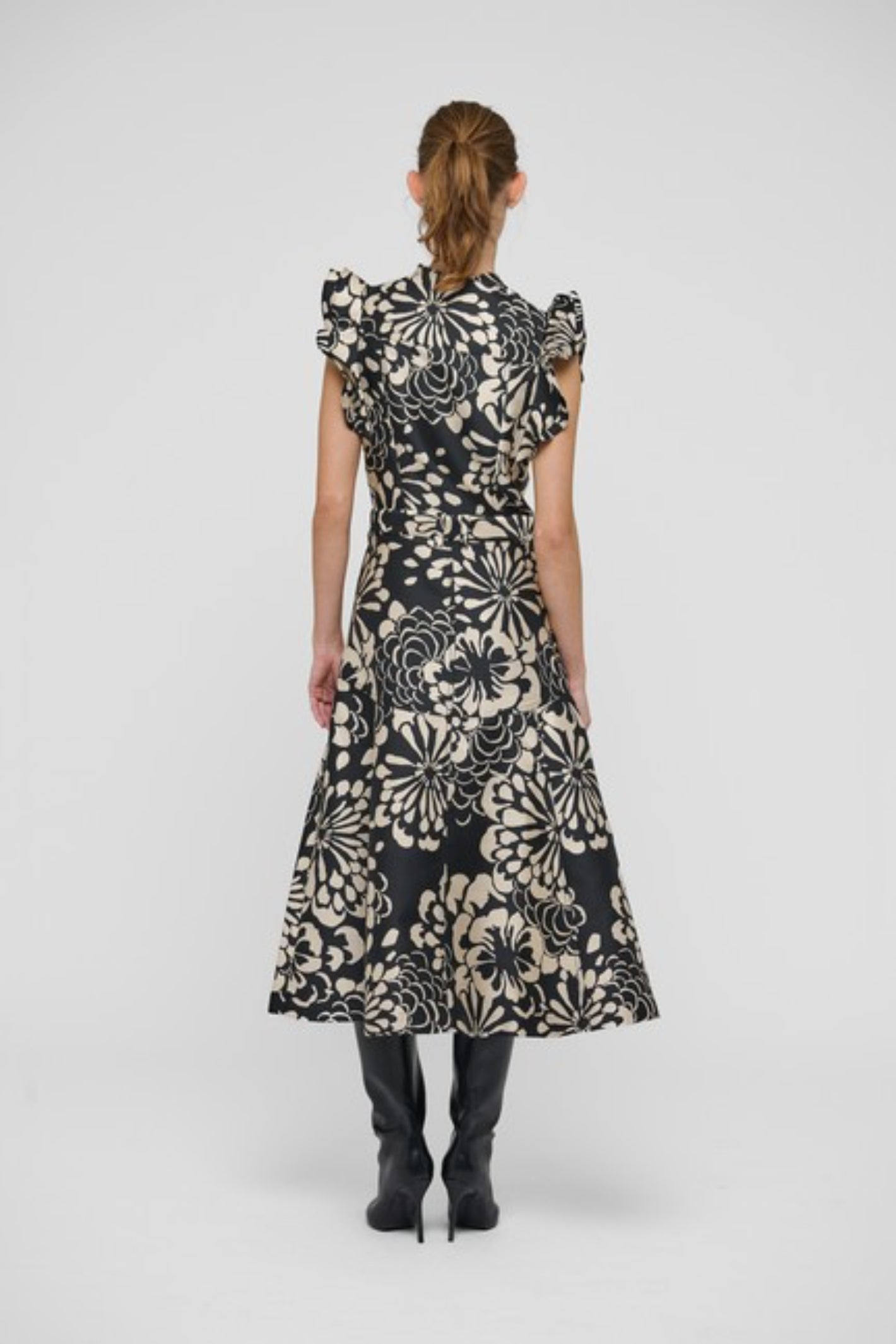 Shop the Dea Kudibal DevantiDEA Dress in Florana at Dotique. A floral jacquard midi dress with frill shoulders, denim details and a flattering flared skirt.