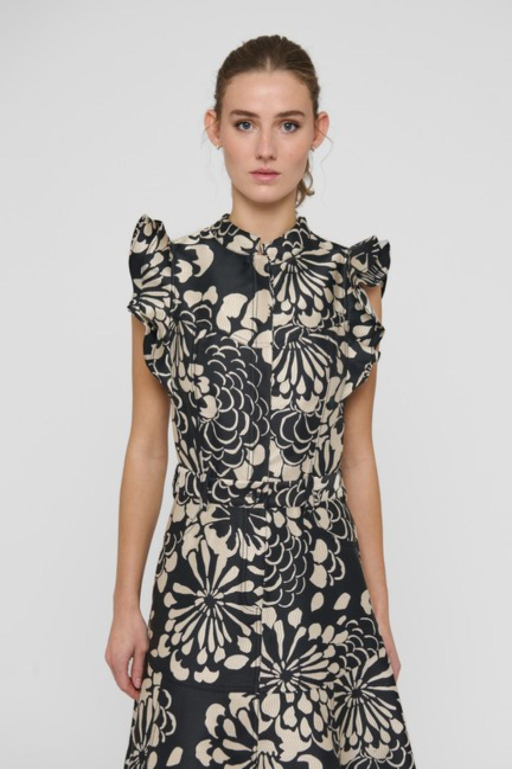 Shop the Dea Kudibal DevantiDEA Dress in Florana at Dotique. A floral jacquard midi dress with frill shoulders, denim details and a flattering flared skirt.