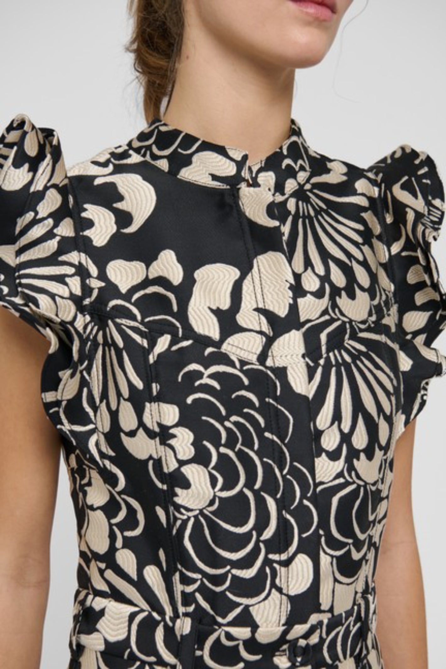 Shop the Dea Kudibal DevantiDEA Dress in Florana at Dotique. A floral jacquard midi dress with frill shoulders, denim details and a flattering flared skirt.