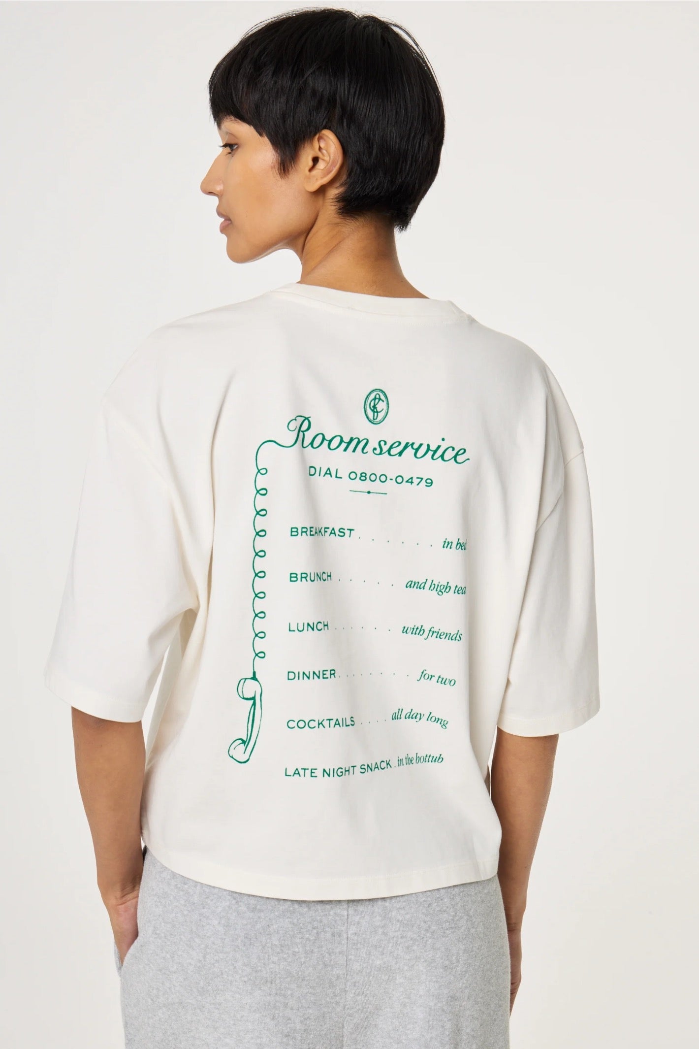Woman wearing Fabienne Chapot Benja T-shirt Cosy White/Green with printed back text, shop Fabienne Chapot at Dotique.