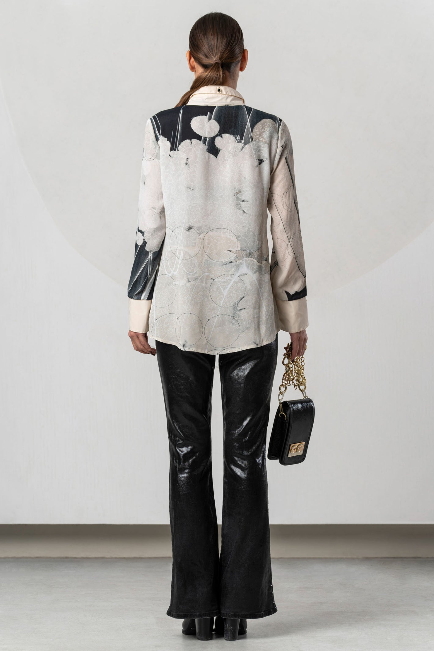 Discover the Elisa Cavaletti ELW261017209 Blouse at Dotique. A premium black and ivory printed blouse with fluid viscose and distinctive detailing.