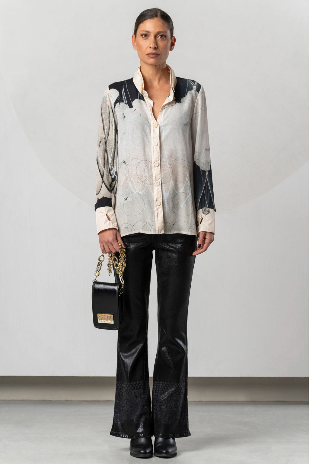 Discover the Elisa Cavaletti ELW261017209 Blouse at Dotique. A premium black and ivory printed blouse with fluid viscose and distinctive detailing.