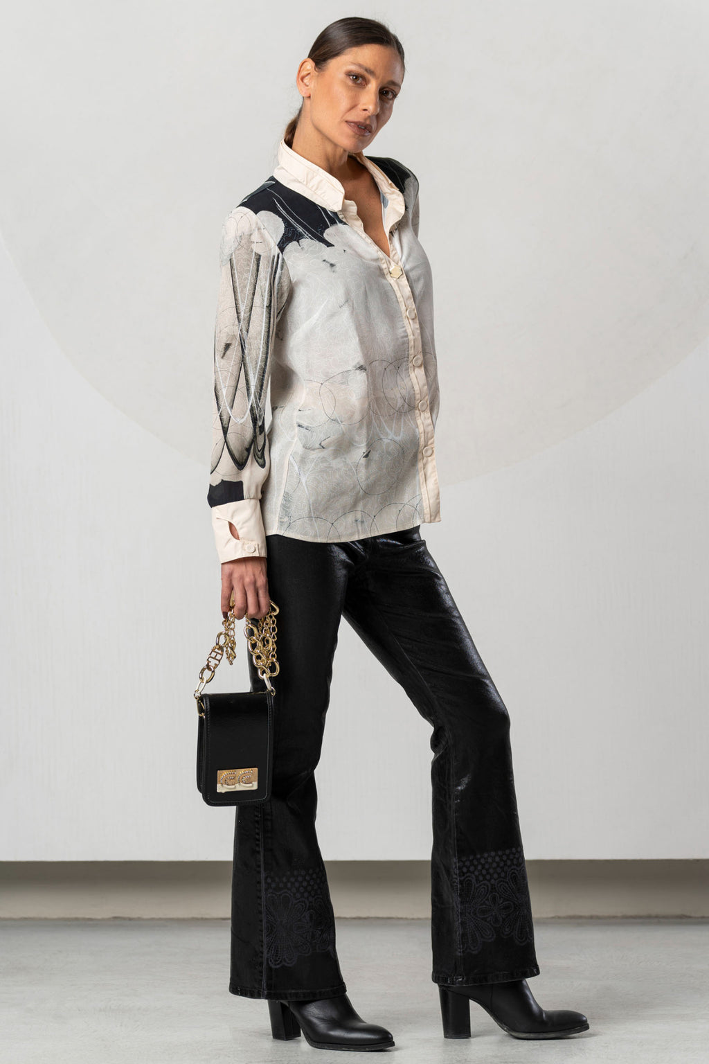 Discover the Elisa Cavaletti ELW261017209 Blouse at Dotique. A premium black and ivory printed blouse with fluid viscose and distinctive detailing.