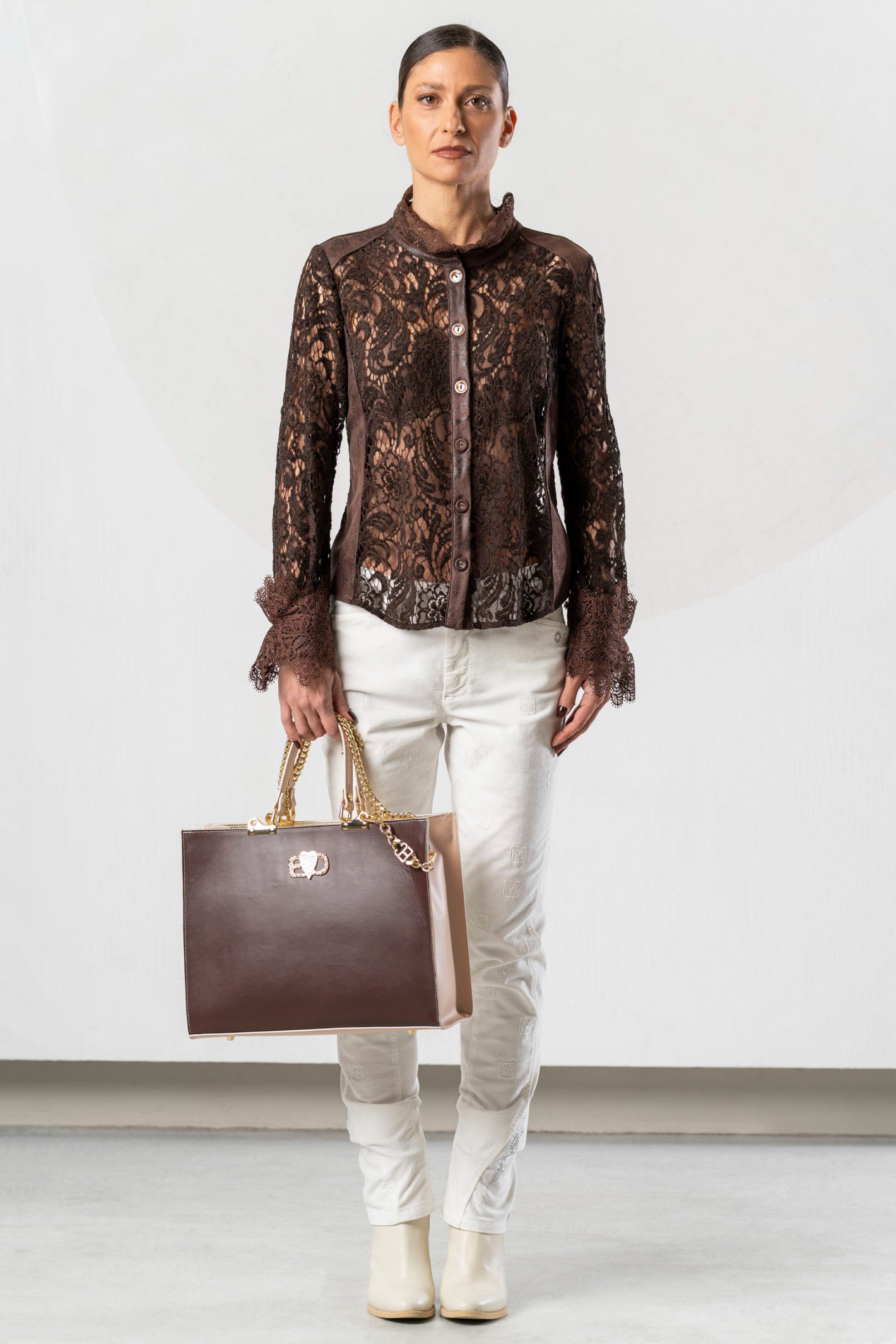 Discover the Elisa Cavaletti ELW261022604 Brown Blouse at Dotique. A premium Italian designer blouse with beautiful detailing in rich chocolate brown.