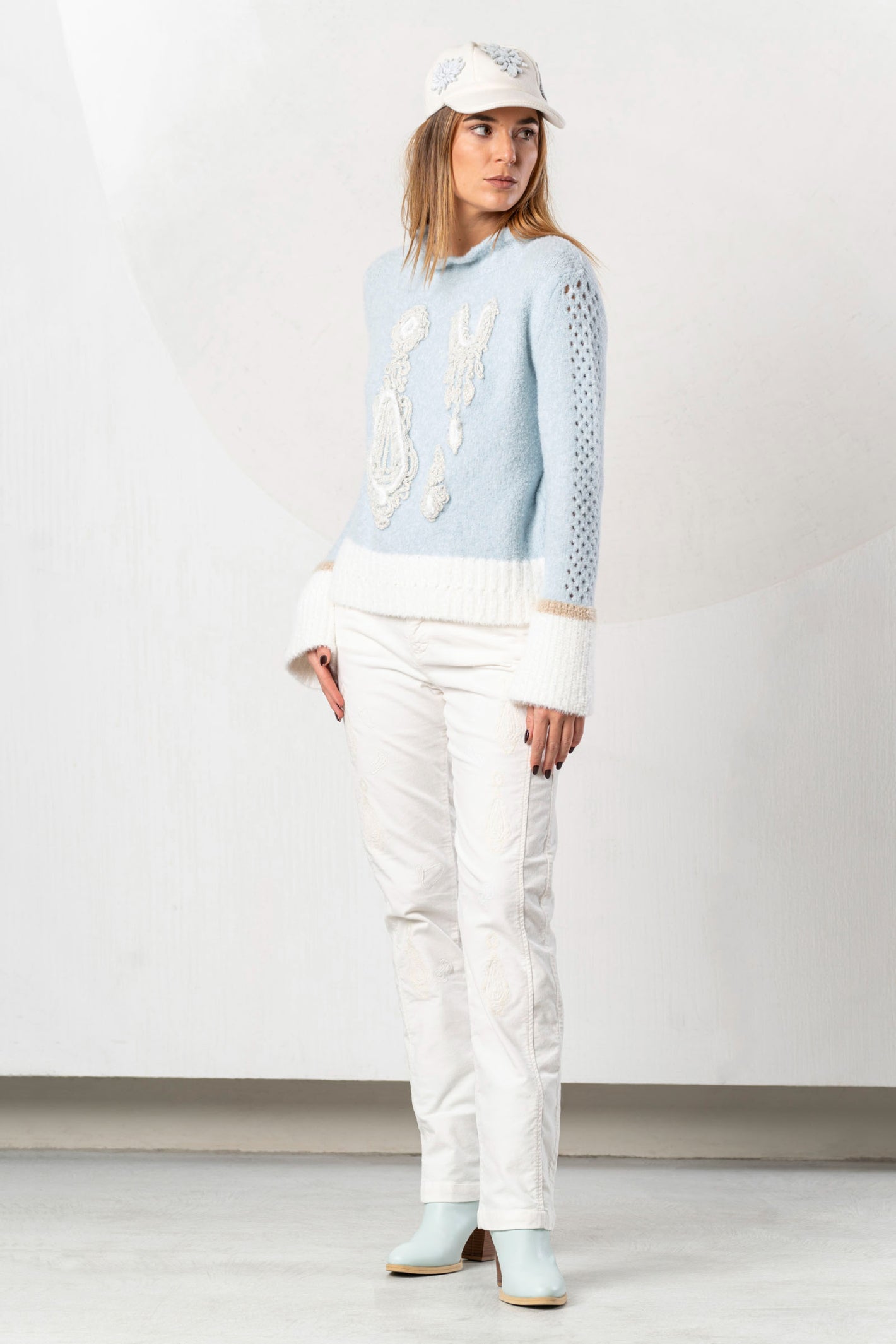 Shop the Elisa Cavaletti ELW264011806 Light Blue Jumper at Dotique. Premium Italian knitwear in a beautiful soft blue with wool and metallic detail.