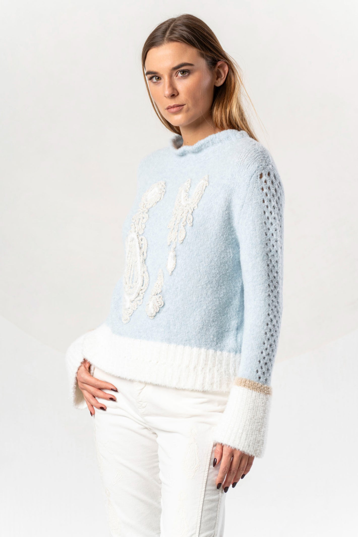 Shop the Elisa Cavaletti ELW264011806 Light Blue Jumper at Dotique. Premium Italian knitwear in a beautiful soft blue with wool and metallic detail.
