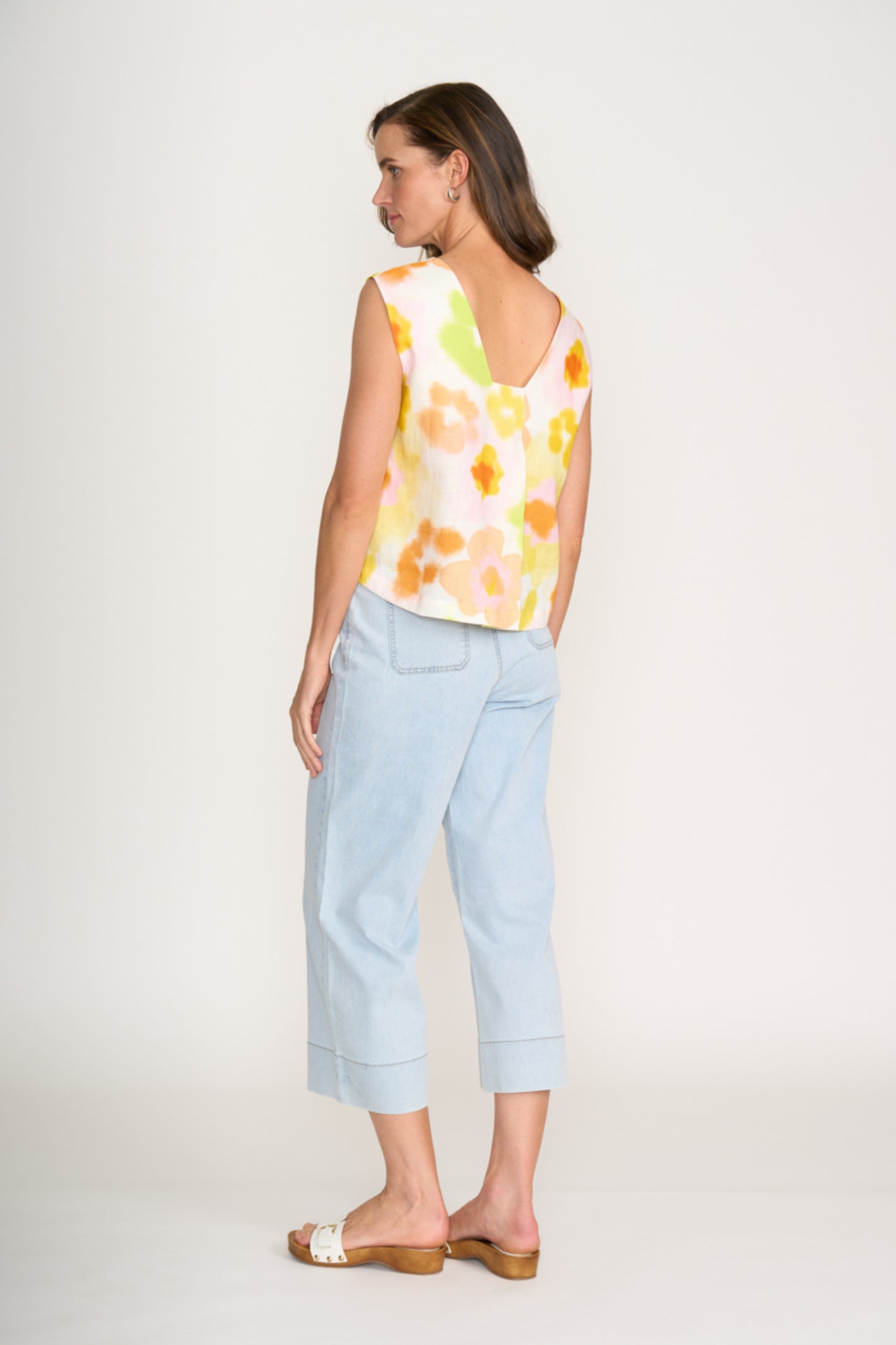 Rear view of model wearing Foil Fo6917 Its Only Natural Top Posh Petals and light blue pants Shop Foil at Dotique