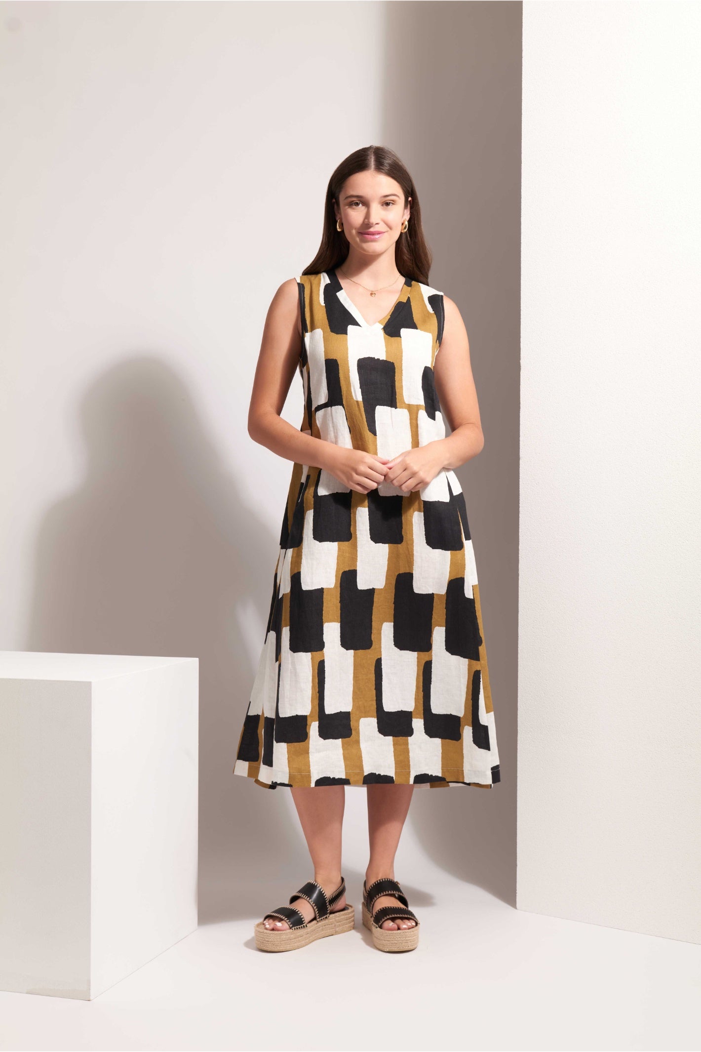 Woman wearing Foil Fo8229 Generosity Dress Art Box by Foil standing, shop Foil at Dotique for stylish dresses.