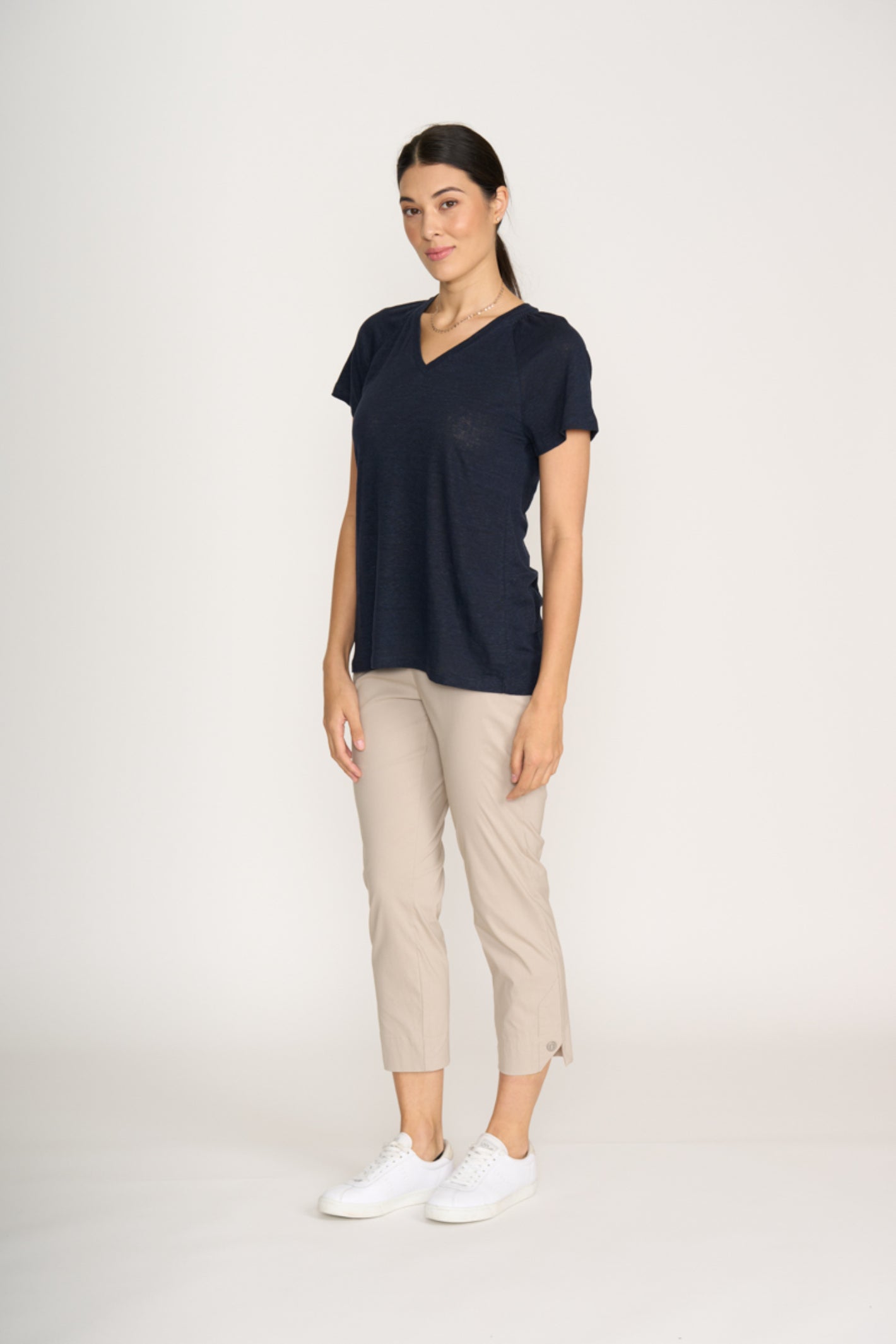 Woman wearing Foil Fo8269 Finish Line Pant Sand styled with navy top, shop Foil at Dotique for versatile casual chic looks.