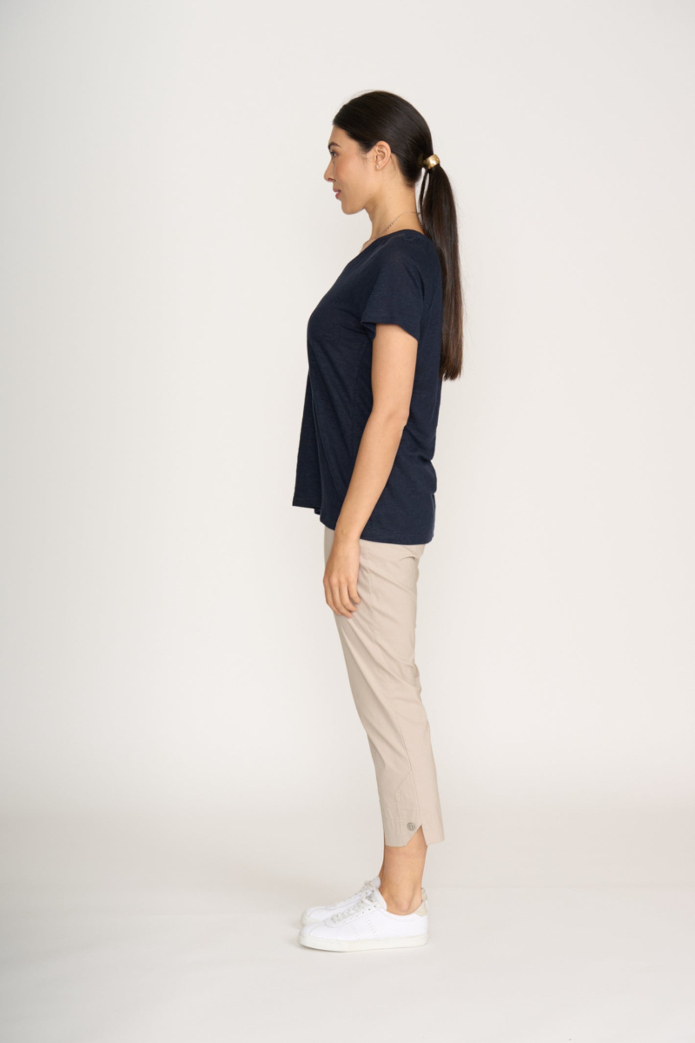 Side view of a woman wearing Foil Fo8269 Finish Line Pant Sand by Foil, shop the vendor at Dotique.