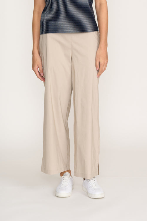Front view of model wearing Foil Fo8259 Broad Horizon Trousers Sand styled with sneakers by Foil Shop at Dotique