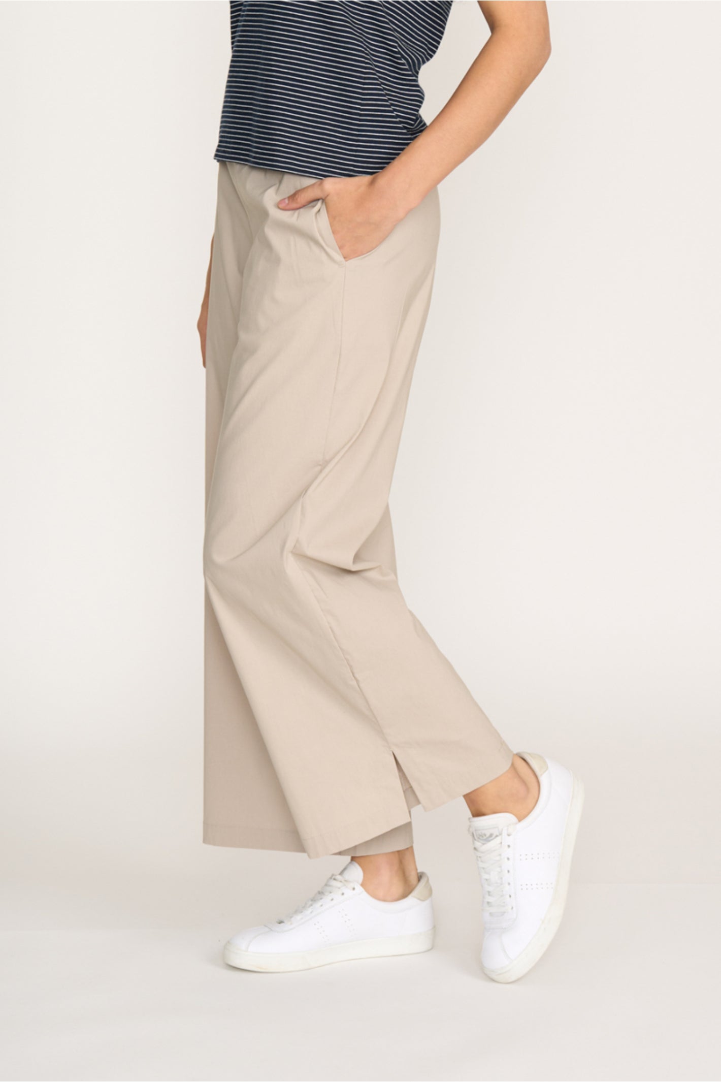 Side view of model wearing Foil Fo8259 Broad Horizon Trousers Sand by Foil Shop at Dotique