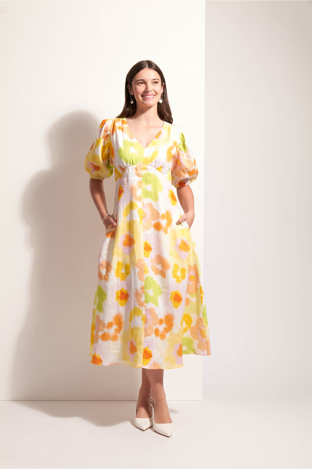 Smiling model in Foil Fo8287 Empire-Ly Yours Dress Posh Petals with floral print Shop Foil at Dotique