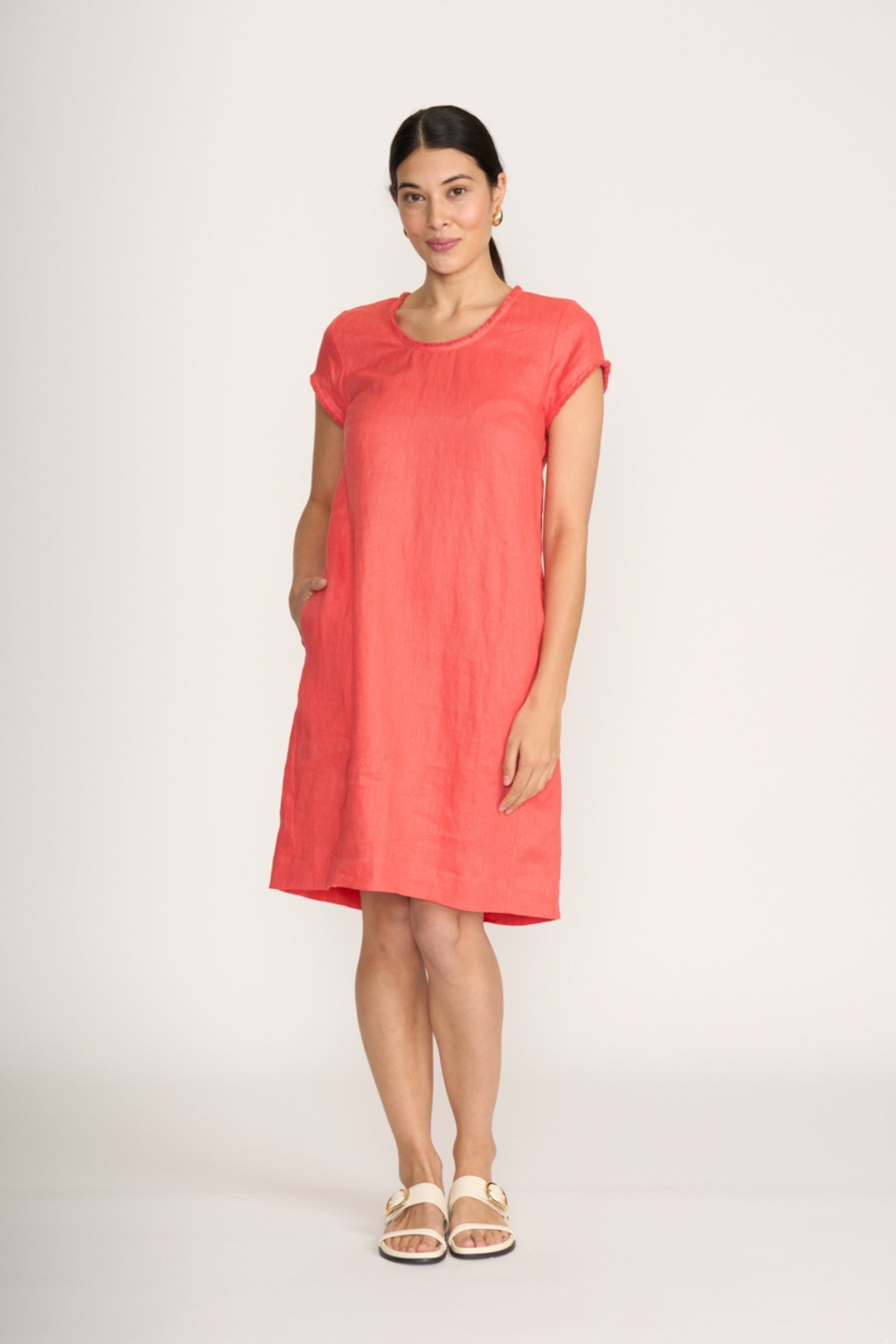 Woman wearing Foil Fo8314 Festival Dress Melon standing, shop Foil at Dotique for comfortable summer dresses