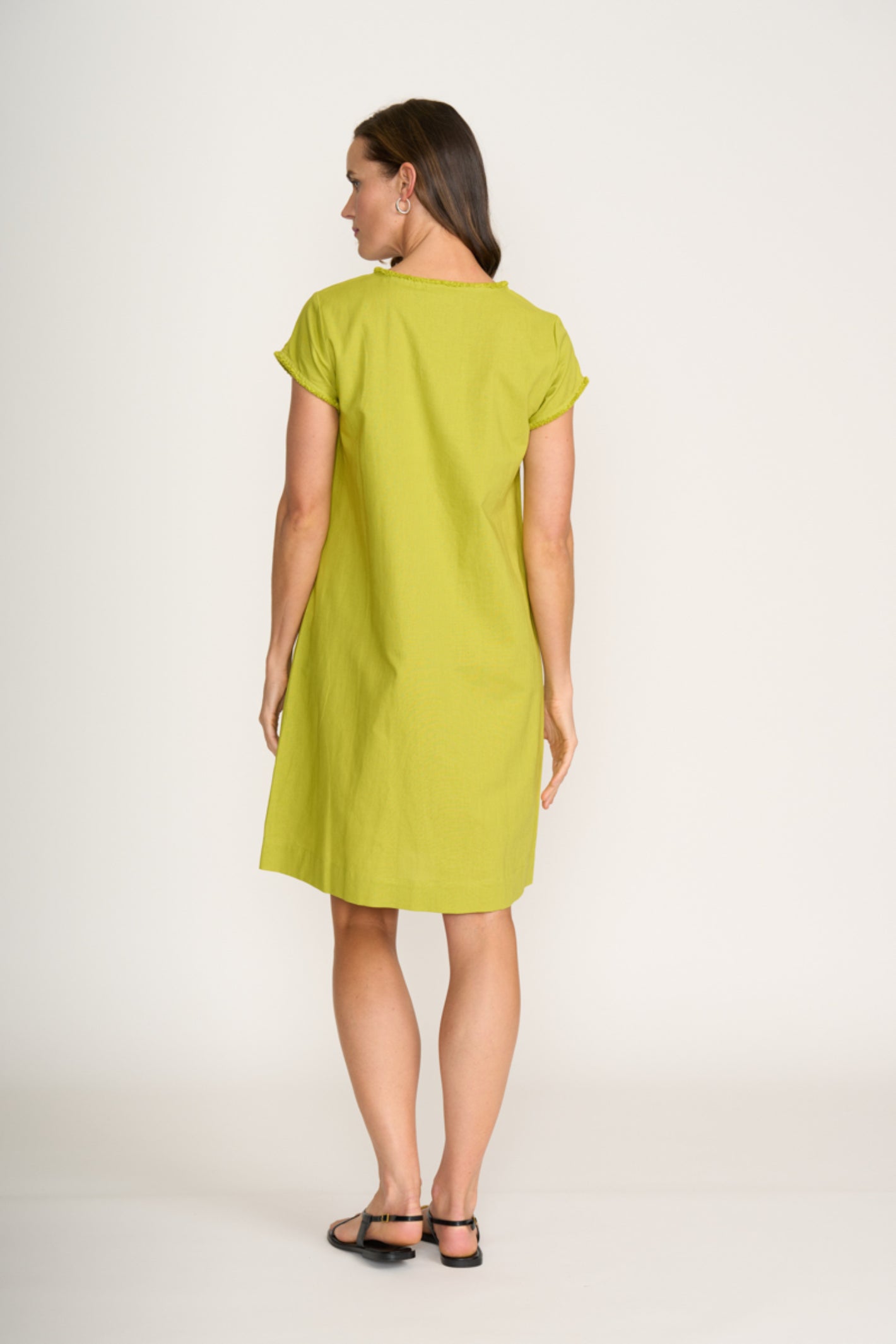 Woman wearing Foil Fo8314 Festival Dress Chartreuse shown from back by Foil shop at Dotique online store.