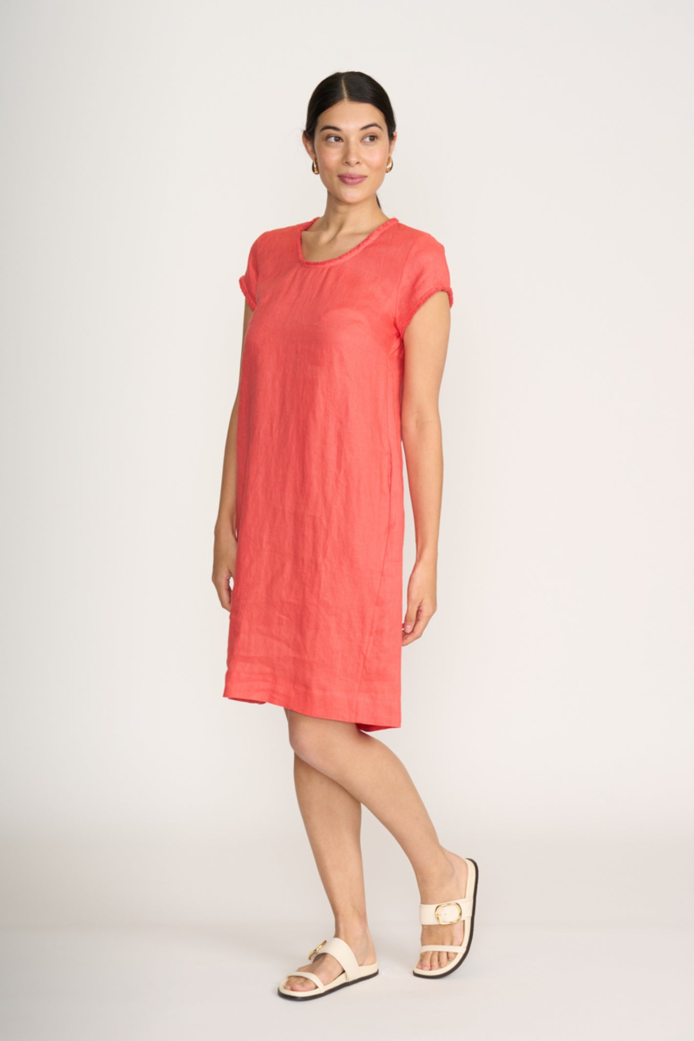 Woman wearing Foil Fo8314 Festival Dress Melon by Foil, shop the vendor at Dotique for relaxed summer style.