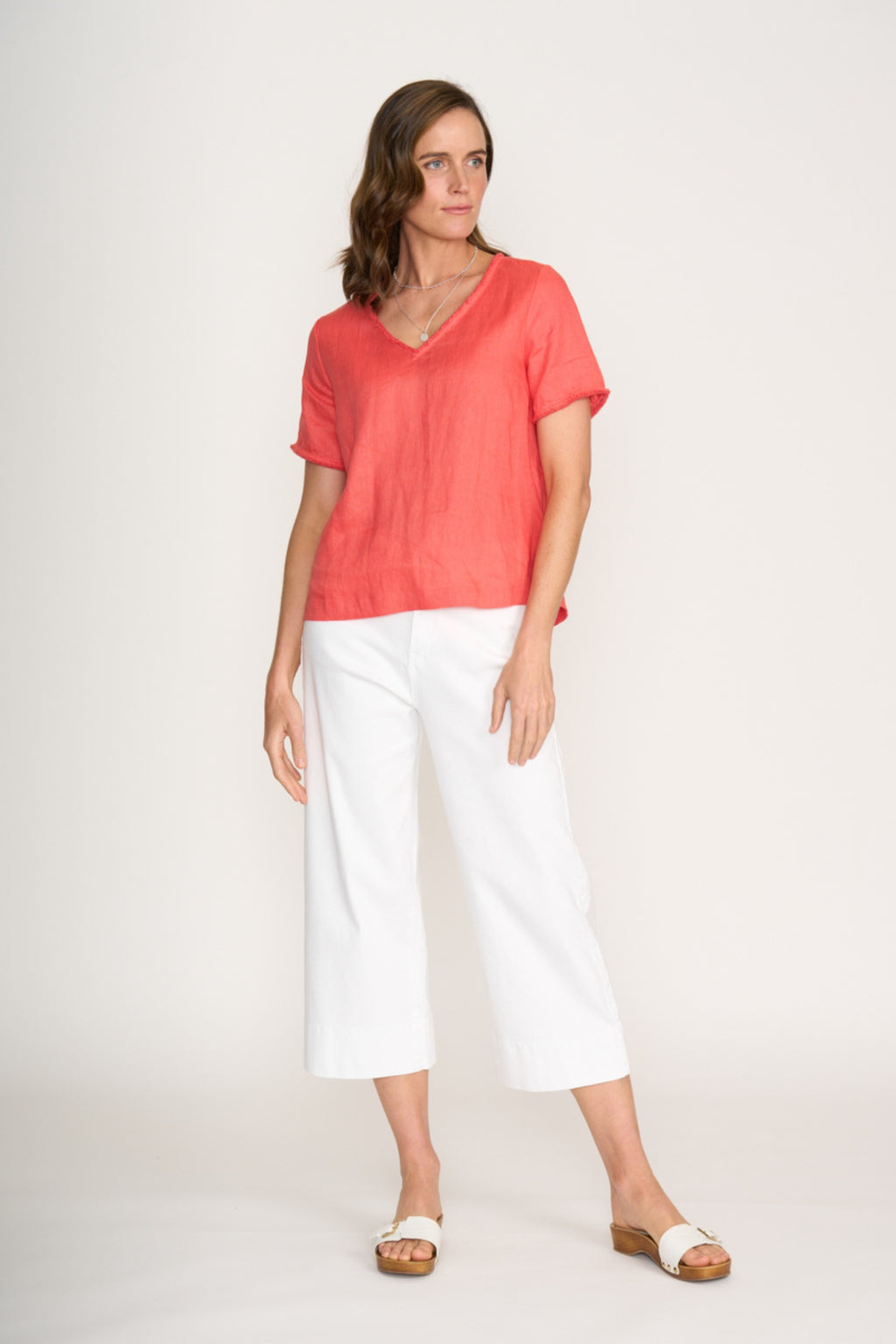 Model wearing Foil Fo8315 V Benefits Top Melon from Foil styled with white pants Shop Foil at Dotique