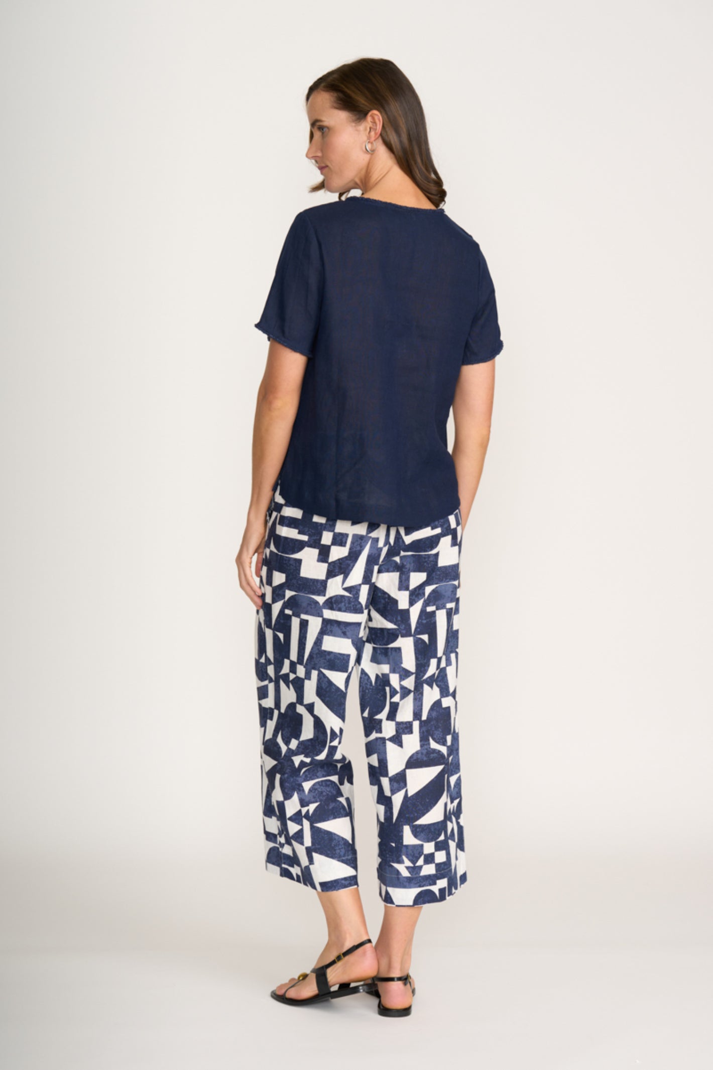 Woman wearing Foil Fo8315 V Benefits Top Eclipse by Foil, shop the vendor at Dotique for stylish casual wear
