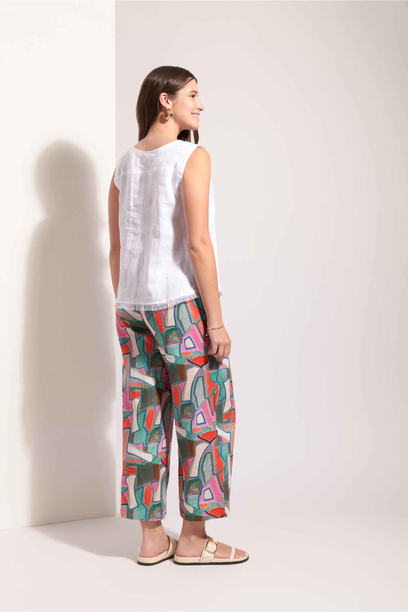 Back view of model in Foil Fo8316 Benefits Shell White by Foil Shop the vendor at Dotique with colorful wide-leg pants