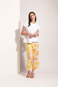 Model wearing Foil Fo8341 Cut Of Your Rib Top White paired with colorful floral pants, shop Foil at Dotique.