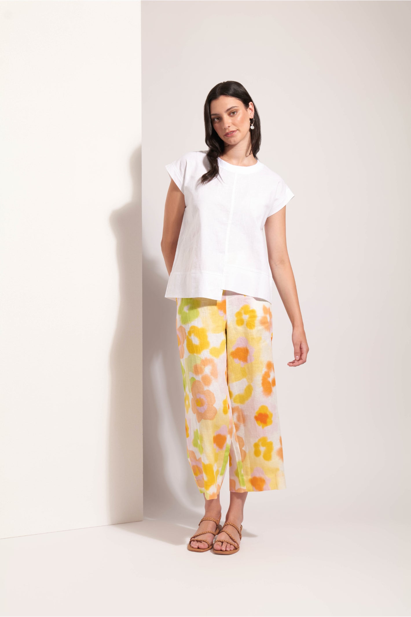 Model wearing Foil Fo8341 Cut Of Your Rib Top White by Foil paired with floral pants, shop Foil at Dotique.