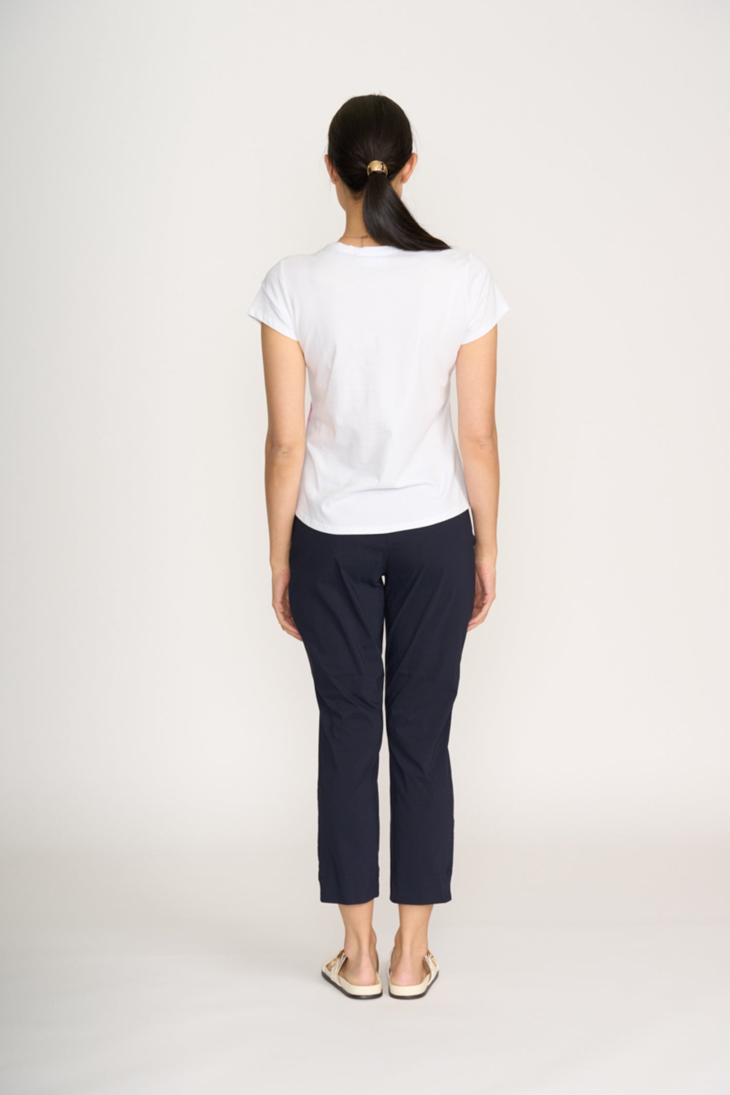Woman wearing Foil Fo8269 Finish Line Pant True Navy from Foil, shop the vendor at Dotique for stylish tapered pants