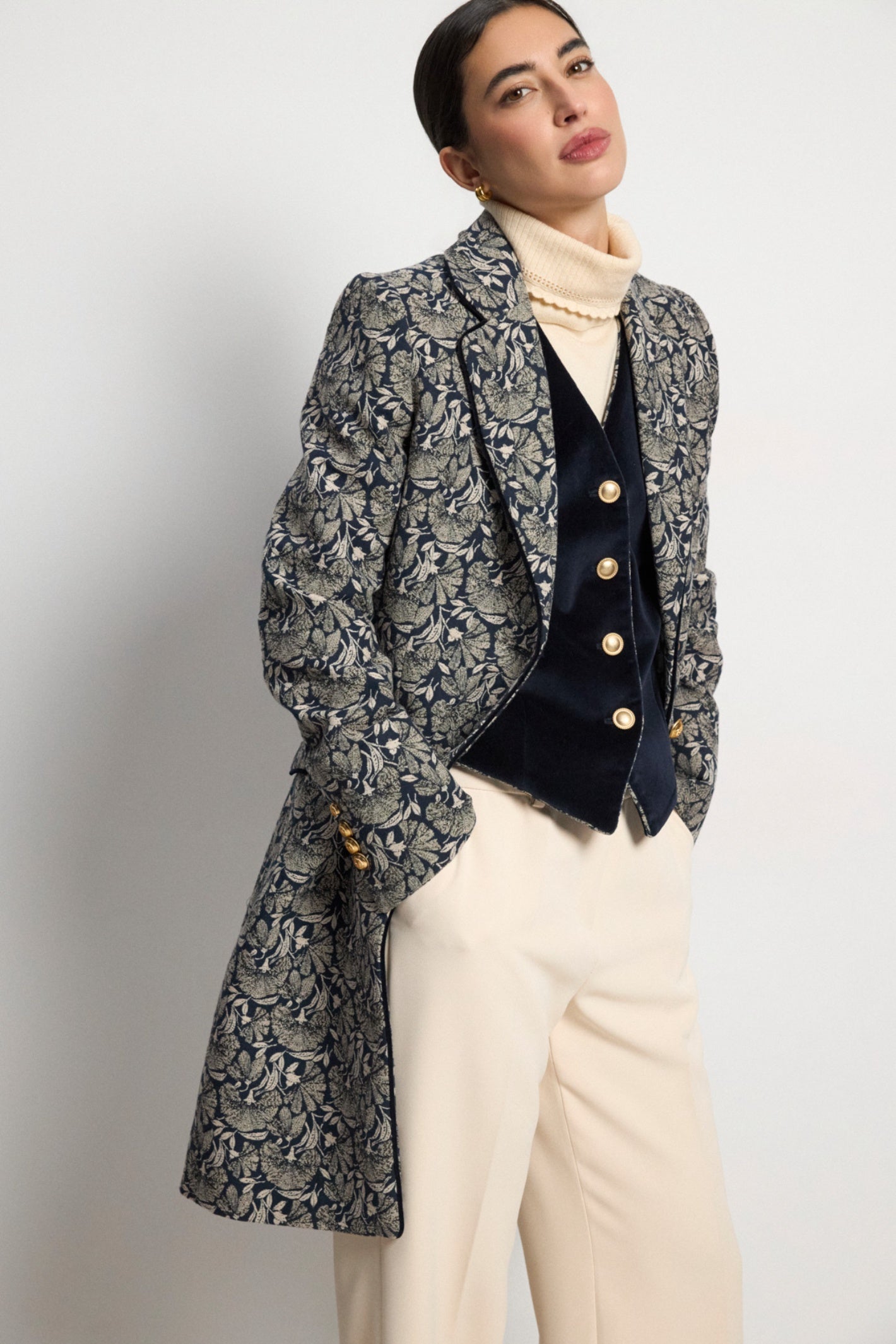 Shop the Bariloche 4041215 Figueres Women's Jacket in Navy at Dotique. A luxurious longline floral jacquard jacket with elegant tailoring, contrast piping and timeless sophistication.