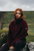 Gym+Coffee Industry Fleece High Collar Jacket Cherry Crush worn by a woman outdoors Shop Gym+Coffee at Dotique