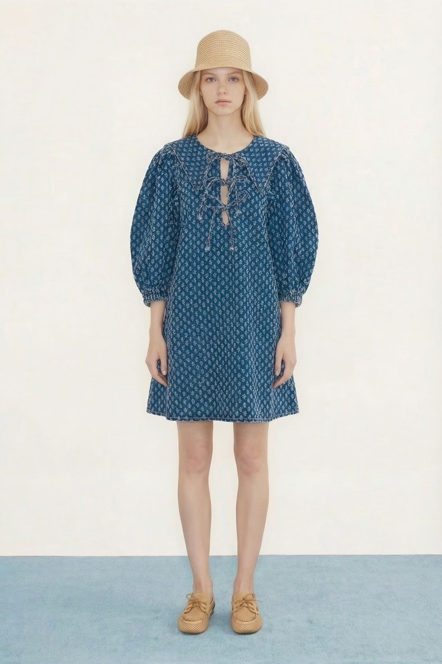 Model wearing Tiny Big Sister Puff Sleeves Denim Dress with lace-up detail by Tiny Big Sister, shop Tiny Big Sister at Dotique gallery 1